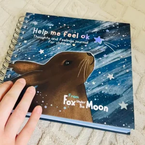 Help me feel ok childrens journal front cover with a rabbit looking up to the stars in the sky