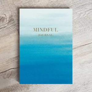 mindful journal. Laid flat. a watercolour effect in a variety of shades of blue. Lightest blue at the top going down to deepest blue at the bottom