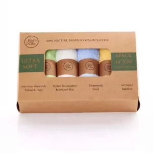 organic bamboo face cloths in a brown cardboard box. Open front shows the cloths rolled with brown label wrapped around them. Colours visible are green, white, blue and orange.
