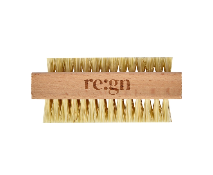 natural bamboo nail brush showing the side profile longer bristles on the bottom and shorter bristles on the top.